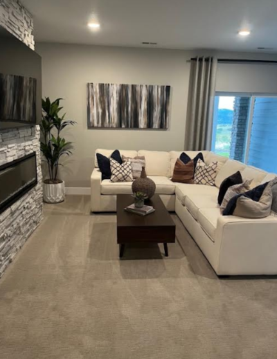 Cozy living room with sectional sofa spotlessly cleaned