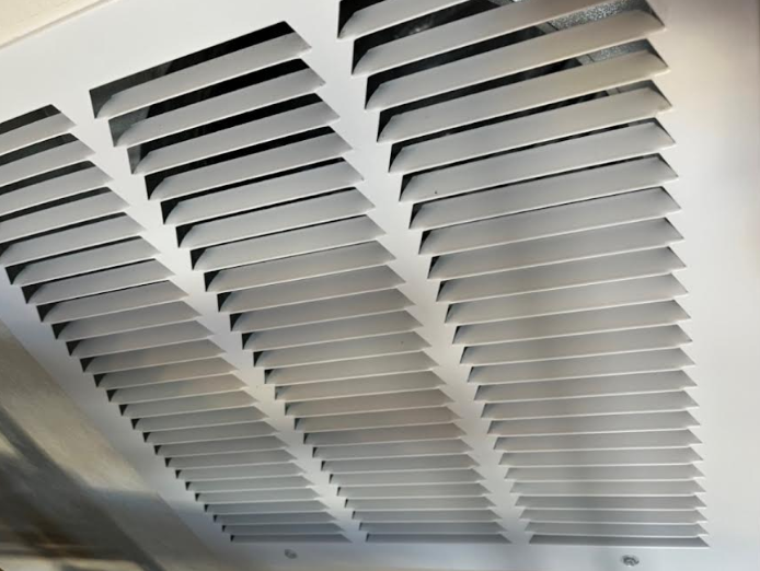 Spotless white air vent after professional cleaning